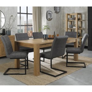 Bentley Designs Turin Light Oak 6-10 Seater Dining Table With 6 Lewis Distressed Dark Grey Fabric Cantilever Chairs